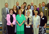 Photo of Bracken family, College of Business representatives, and several student scholarship winners