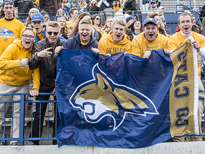 student cheering at football game