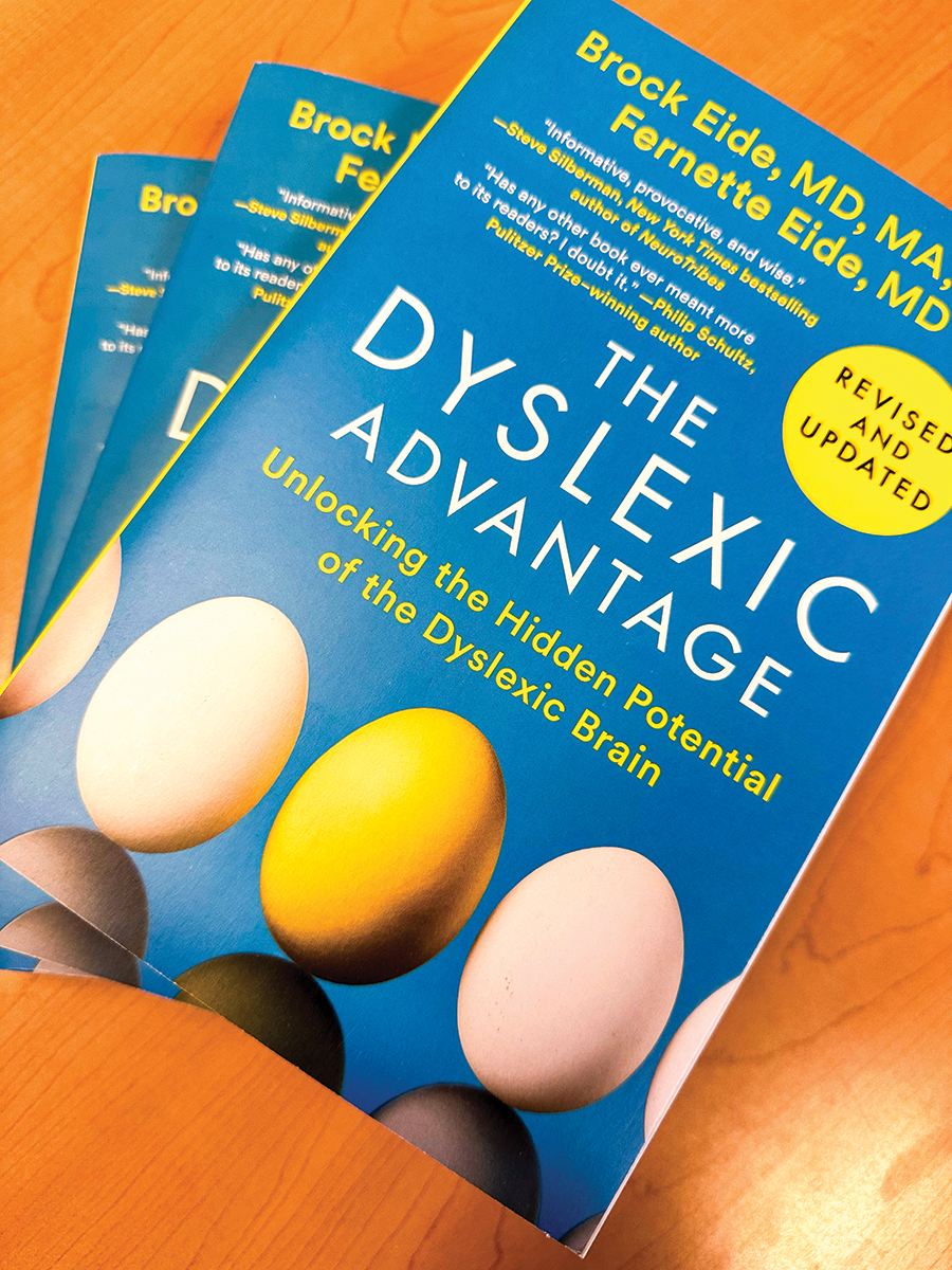 A blue book with the title 'The Dyslexic Advantage' on the front