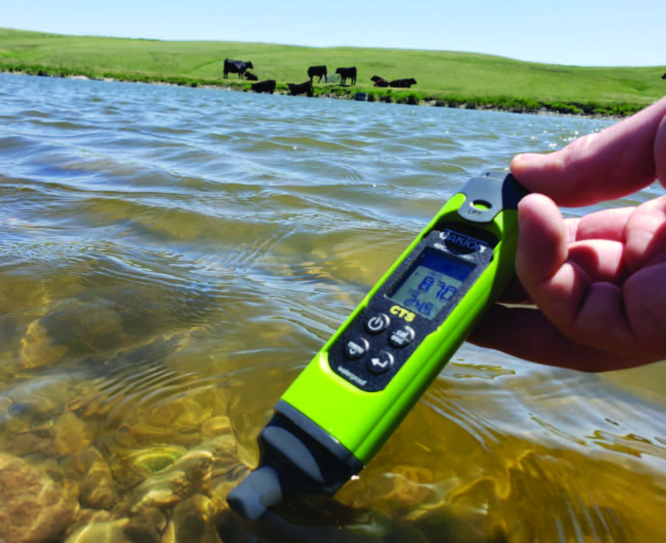 a green water tester used to test drinking water for cattle