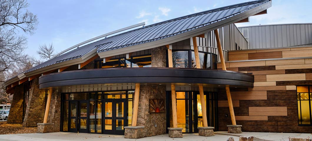 American Indian Hall's eastern entrance is a combination of stone, wood and metal. The shape of the roof resembles an eagle's wing.