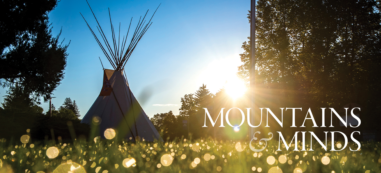 An American Indian lodge at sunrise on campus