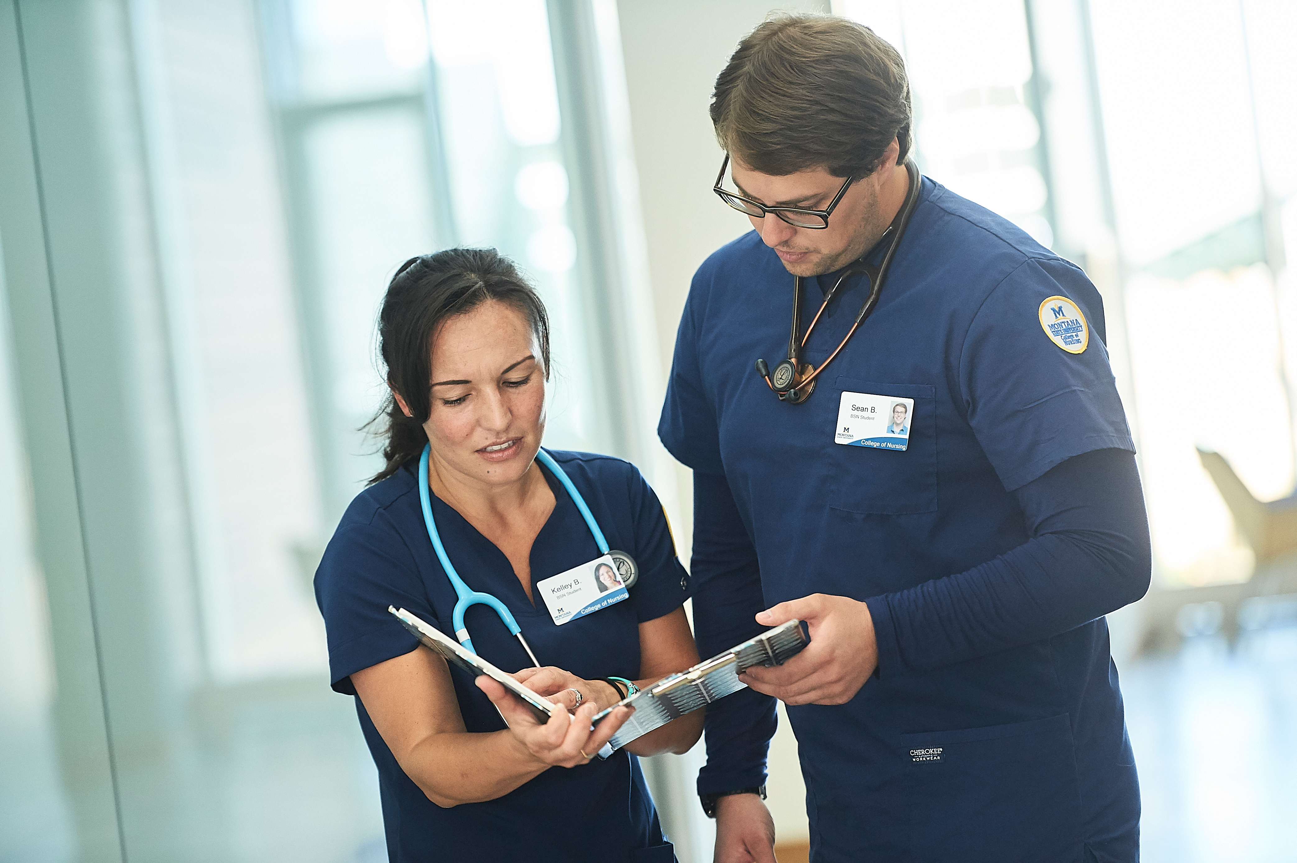 Nursing students looking at a chart