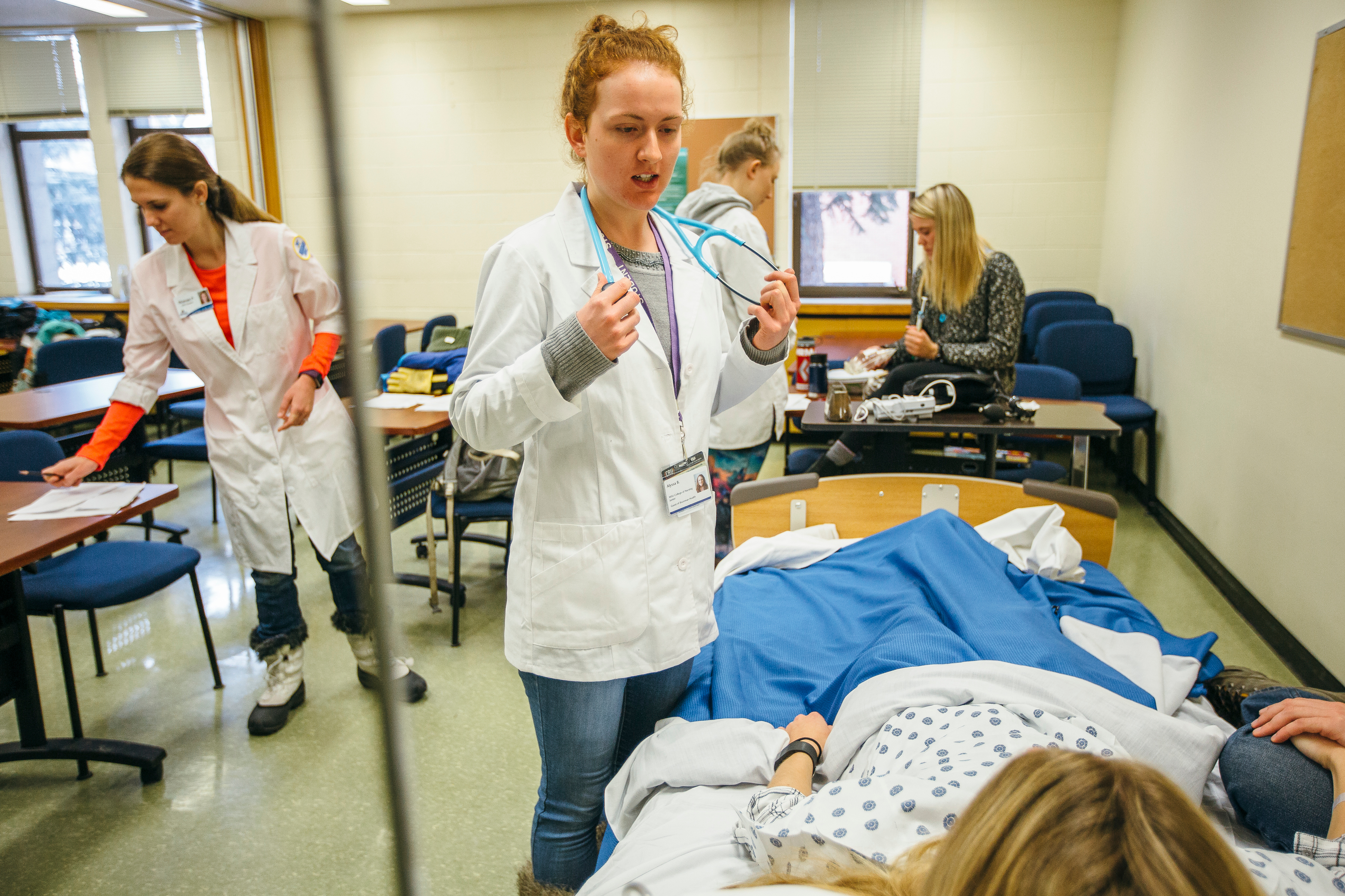 nursing student talking to patient