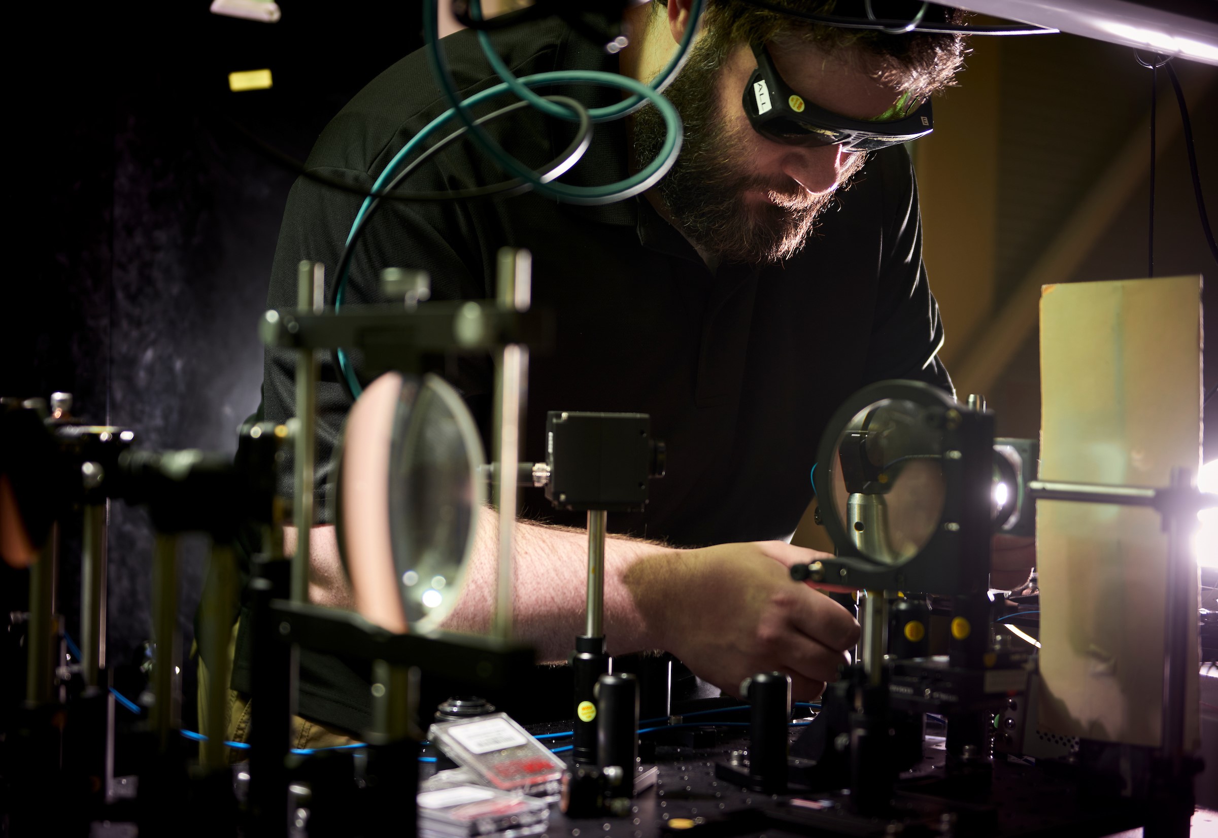 man in photonics lab