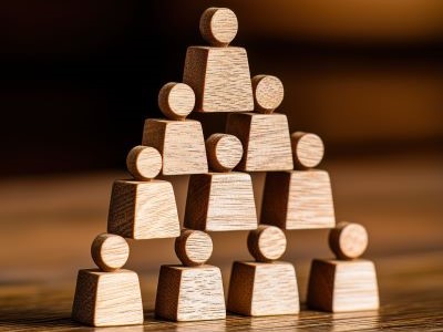 wooden people in pyramid