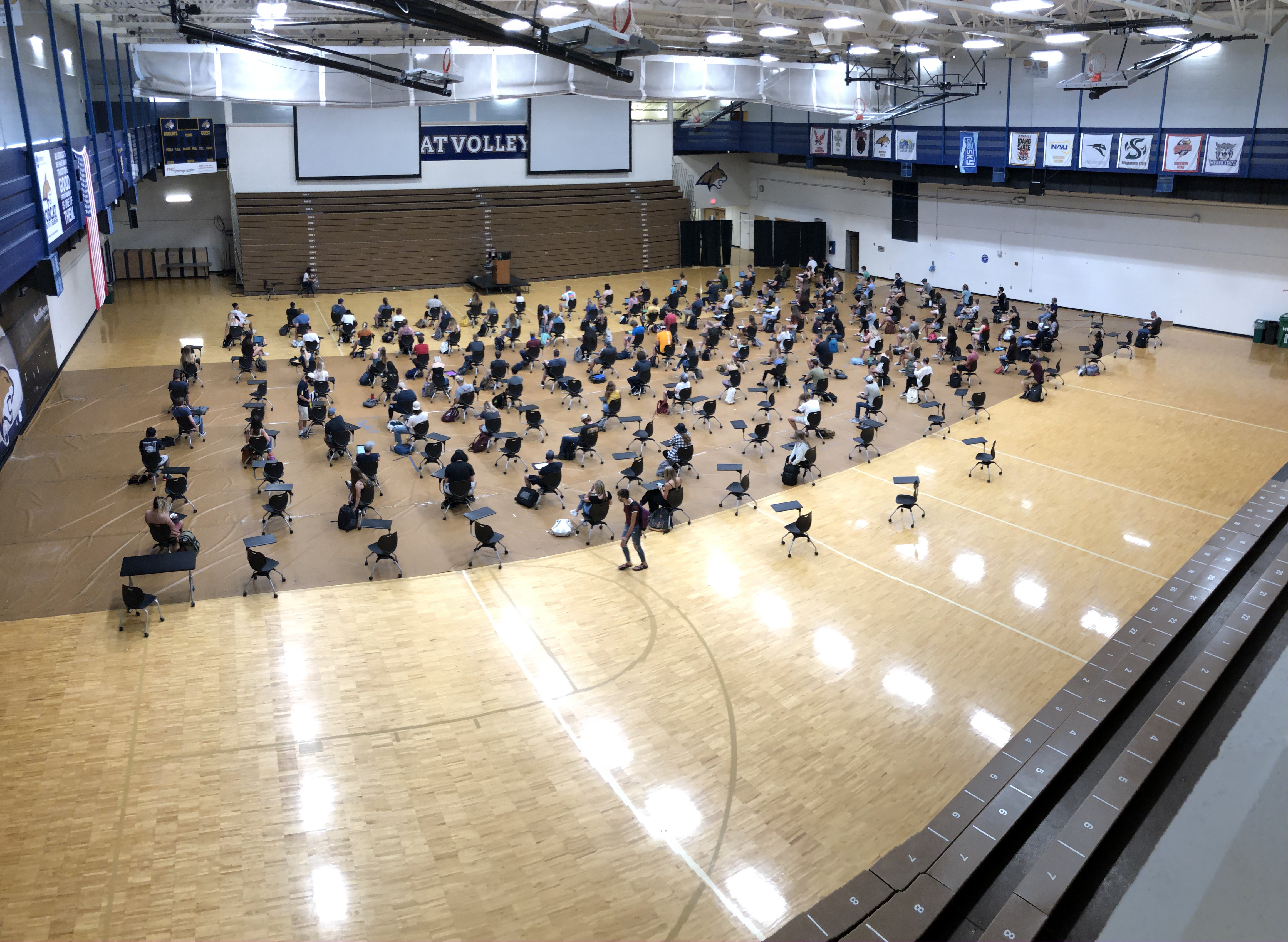 students in shroyer gym for lecture