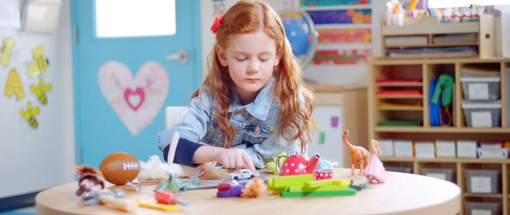 Girl playing with matchbox car