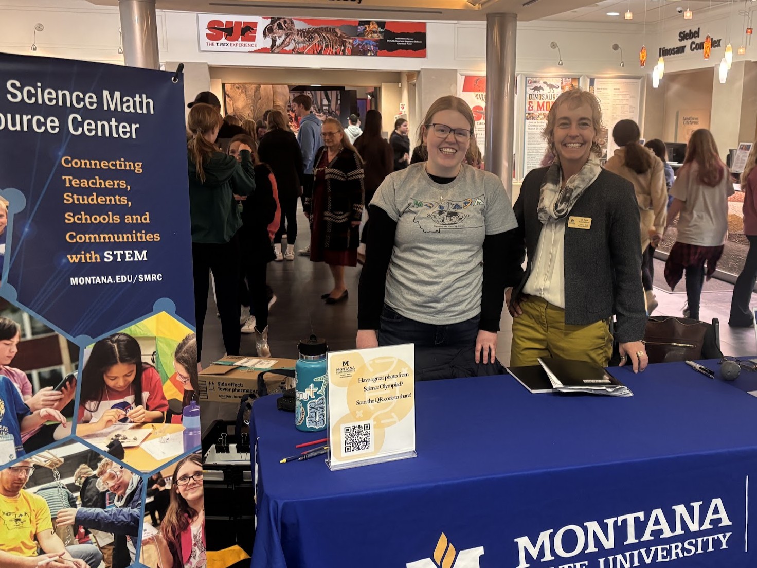 SMRC employees pose at Science Olympiad booth