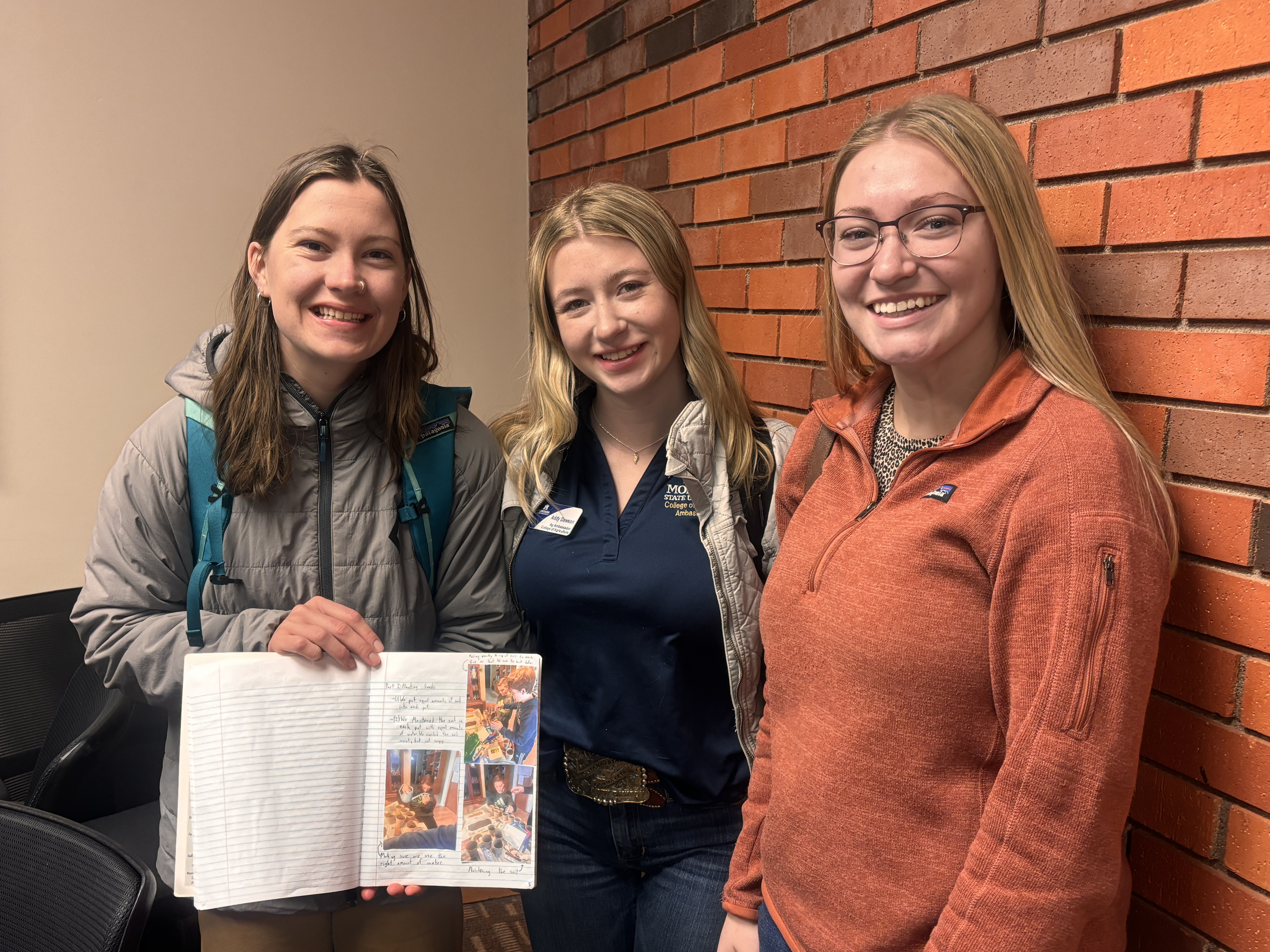 a photo of three event supervisors