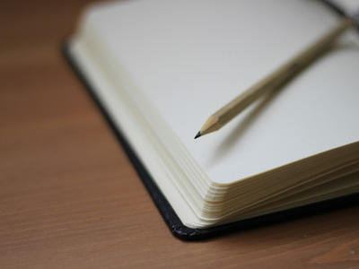 Stock image of a pencil on a notebook
