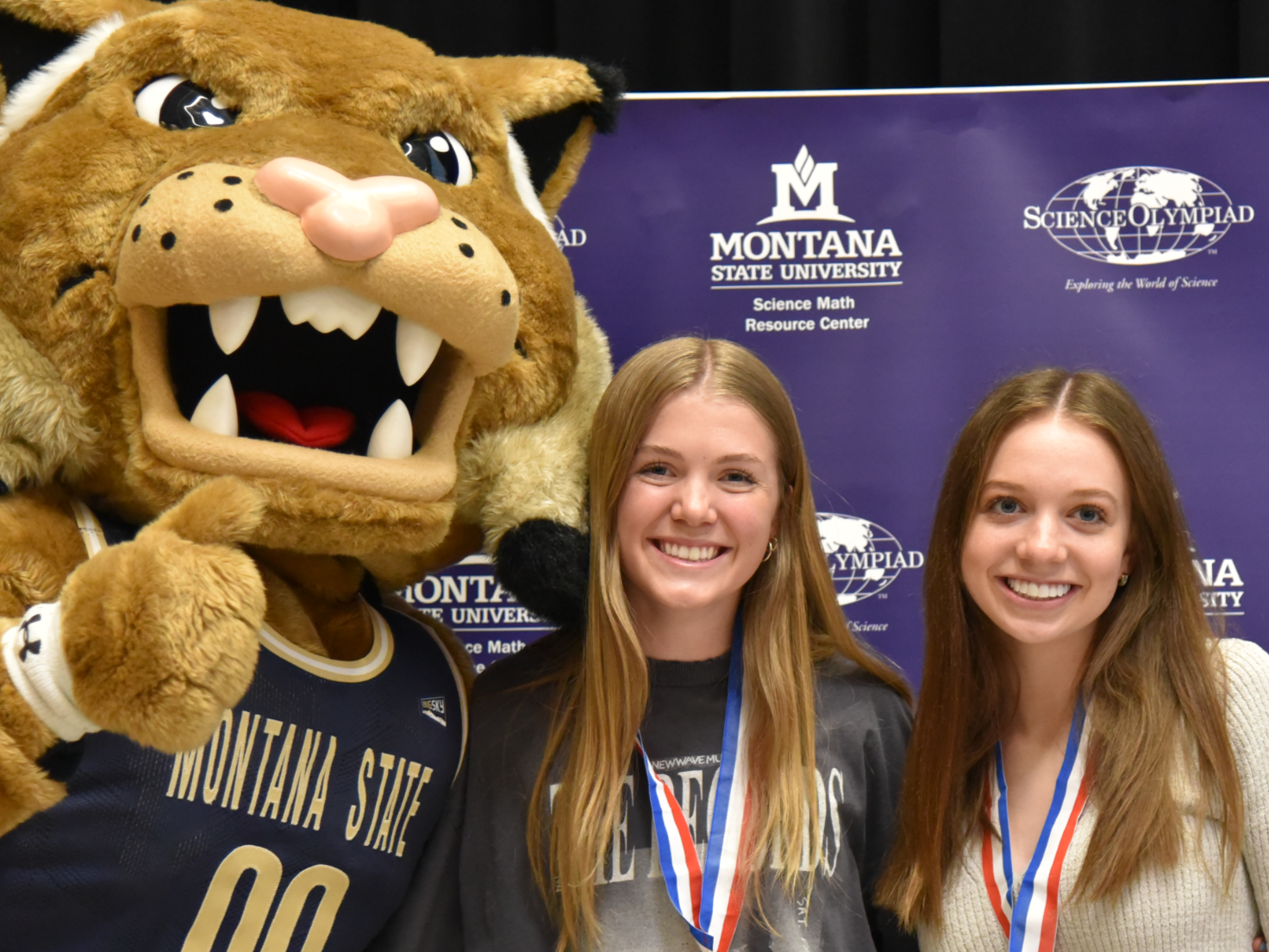 Science Olympiad participants pose with Champ