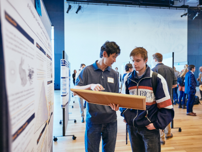 Two students discussing research