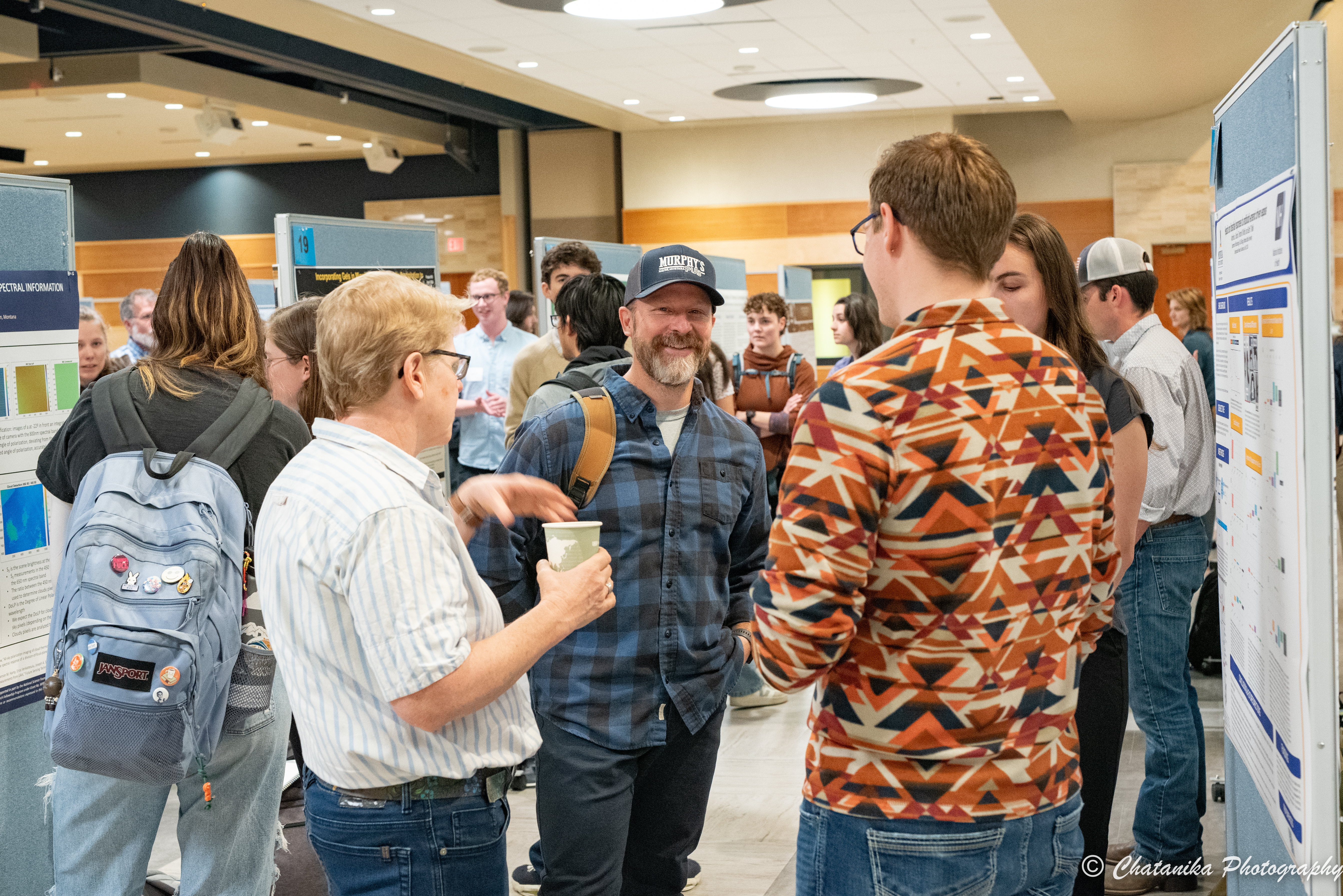 student research celebration conversing participants